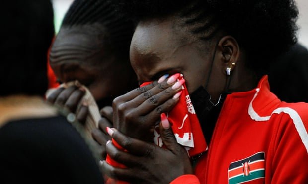 Kenyan athletes mourn during the funeral service of long-distance runner Agnes Tirop in Kapnyamisa village, Nandi county, Kenya. Photograph: Monicah Mwangi/Reuters