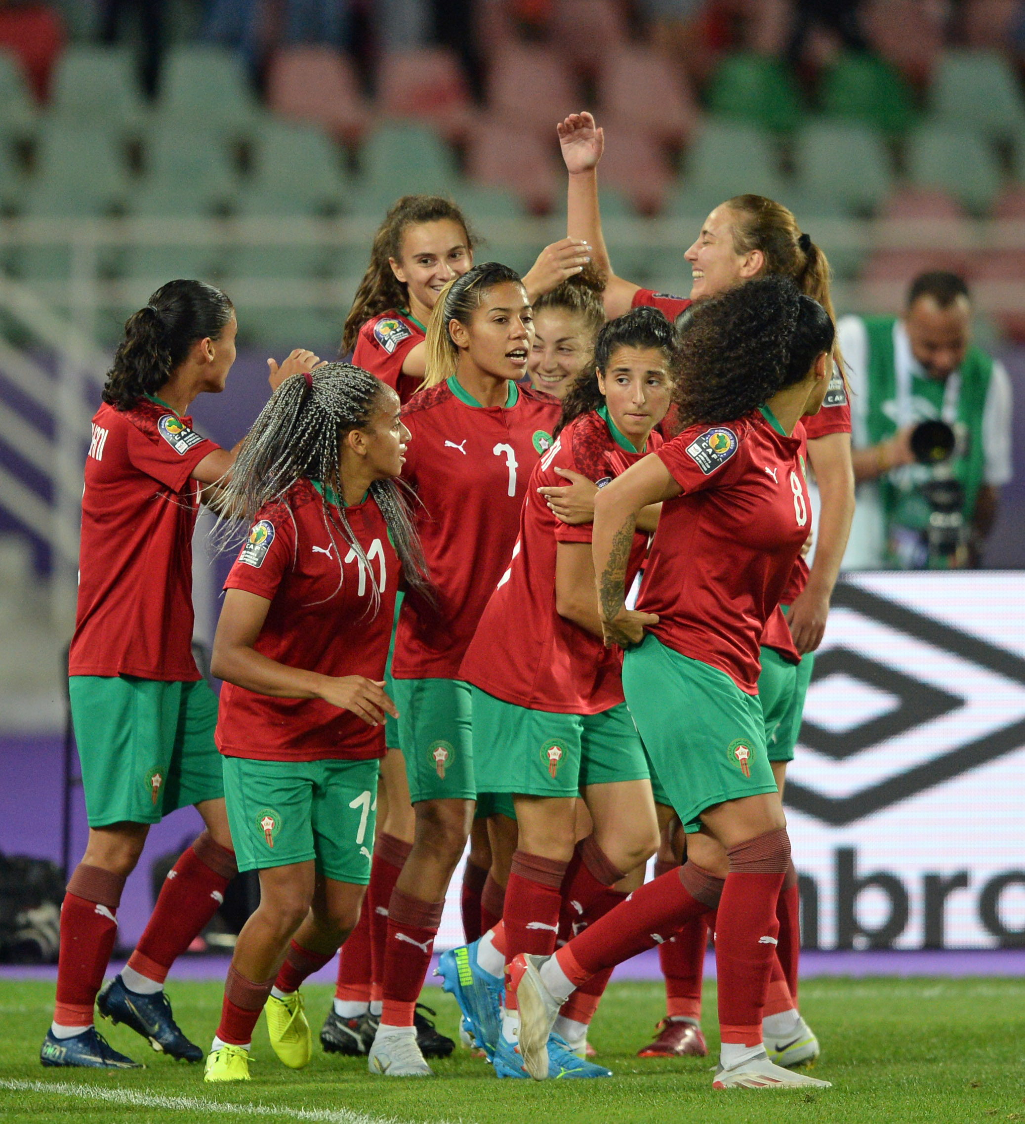 Morocco celebrate one of their three goals against Uganda