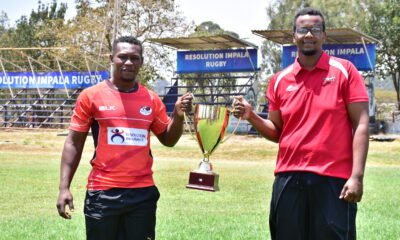 Paul Mutsami L of Impala and Joseph Wachira of Nondies with the Impala Floodlit trophy during the tournament draw.