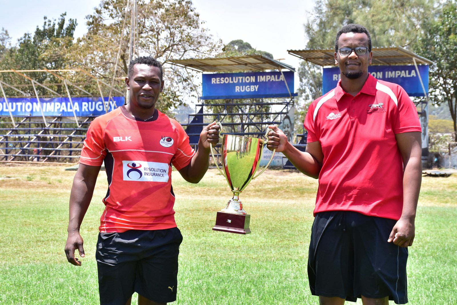 Paul Mutsami L of Impala and Joseph Wachira of Nondies with the Impala Floodlit trophy during the tournament draw. scaled