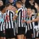 Newcastle Celebrate win as they move second.