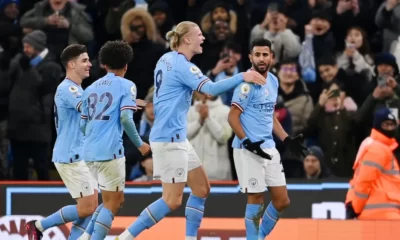 Manchester City celebrate a comeback win against Tottenham.