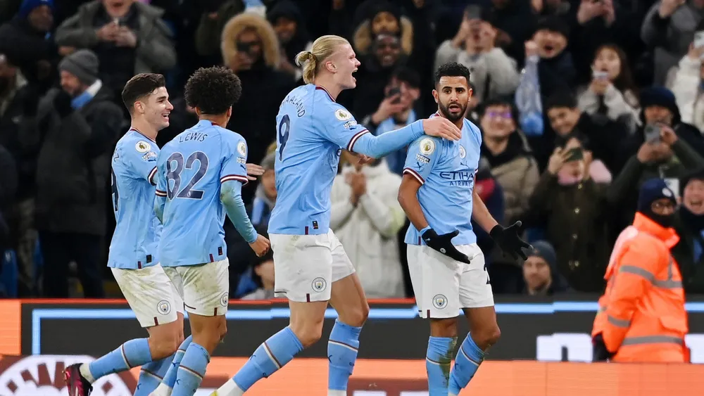 Manchester City celebrate a comeback win against Tottenham.