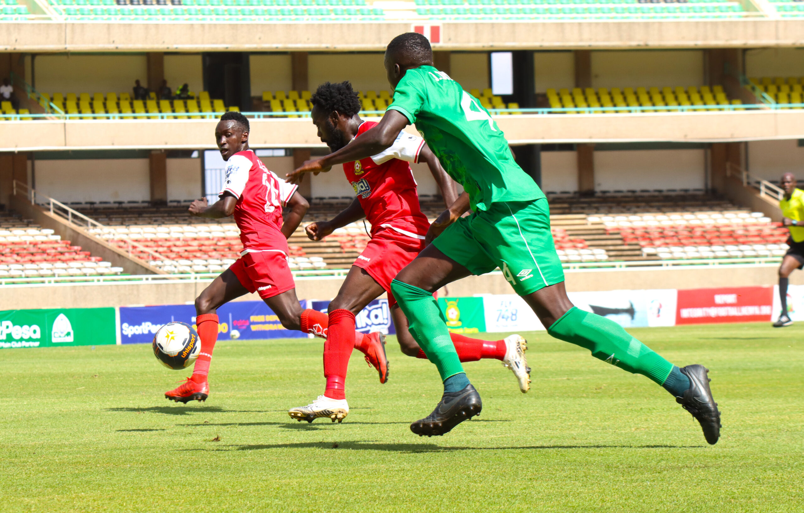 Elvis Rupia strides forward against Joshua Onyango