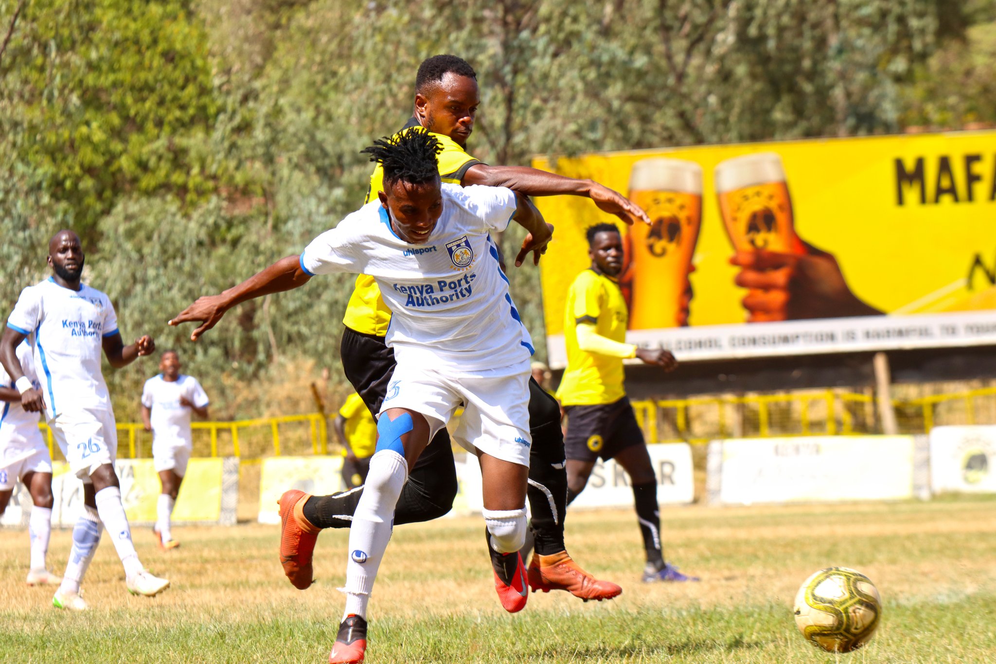 TUsker's Shami Kibwana tussles for the ball with James Kinyanjui of Bandari