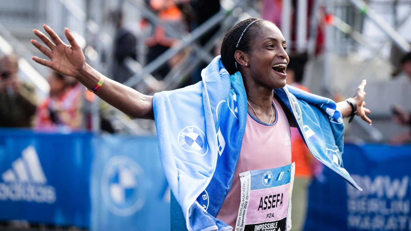 Ethiopia's Tigst Assefa celebrates after winning in Berlin