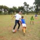 Luis Garcia enjoys a kick about with the kids from Diamond and Acakoro Academies