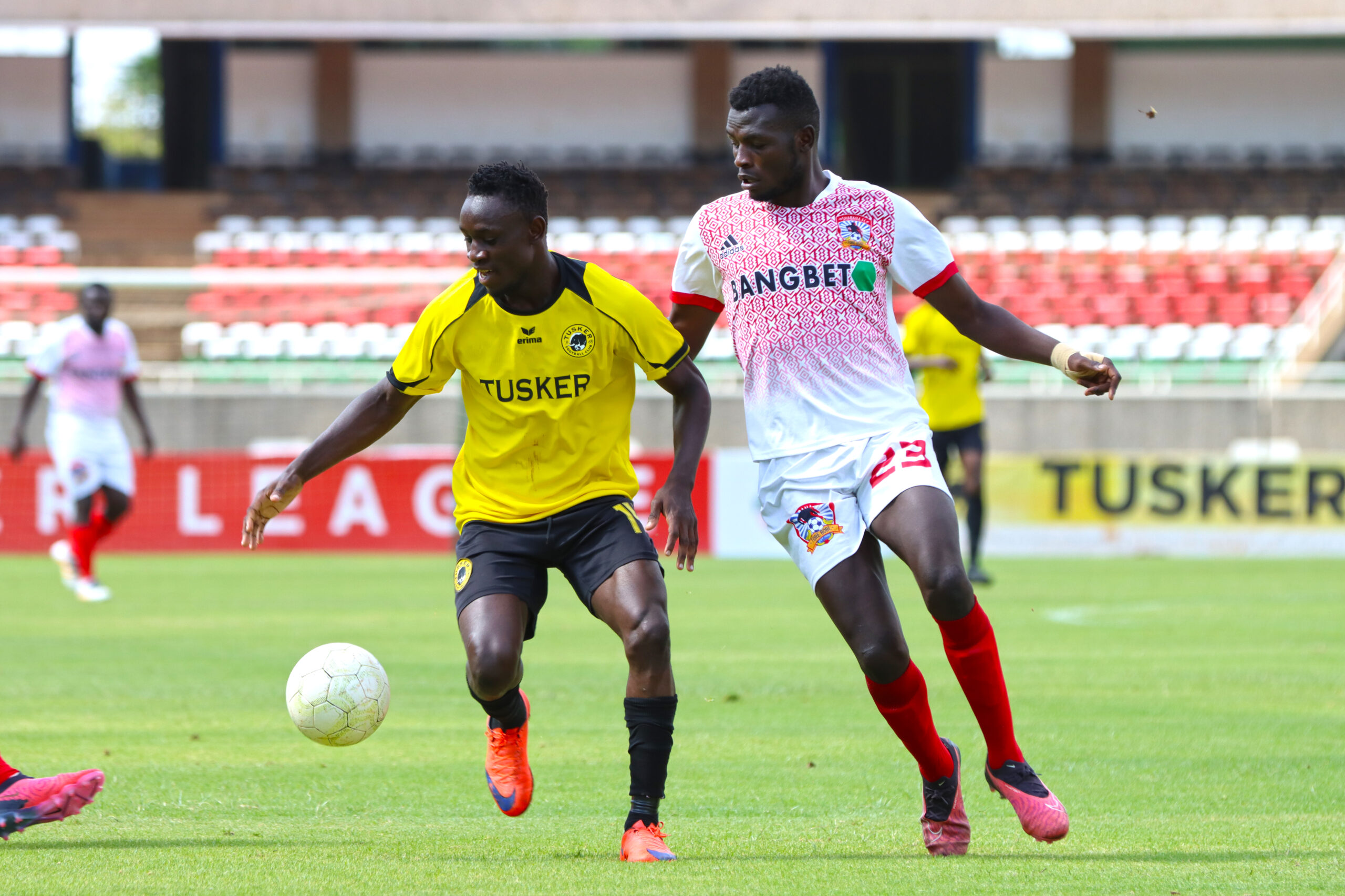 Tusker FC's Shaphan Oyugi goes up against Shabana's George Onyango