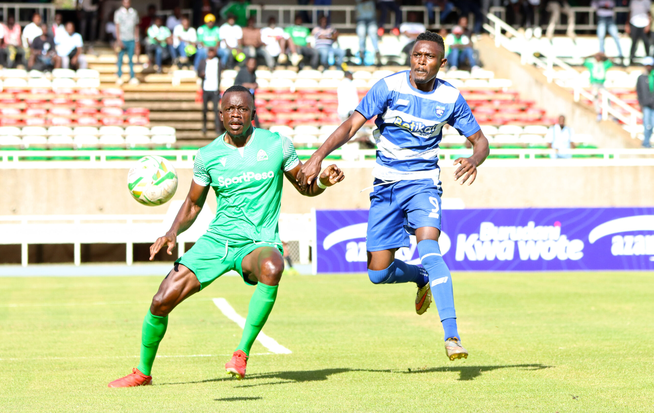 Kennedy Onyango of Gor Mahia battles for the ball with AFC Leopards' Brian Yakhama