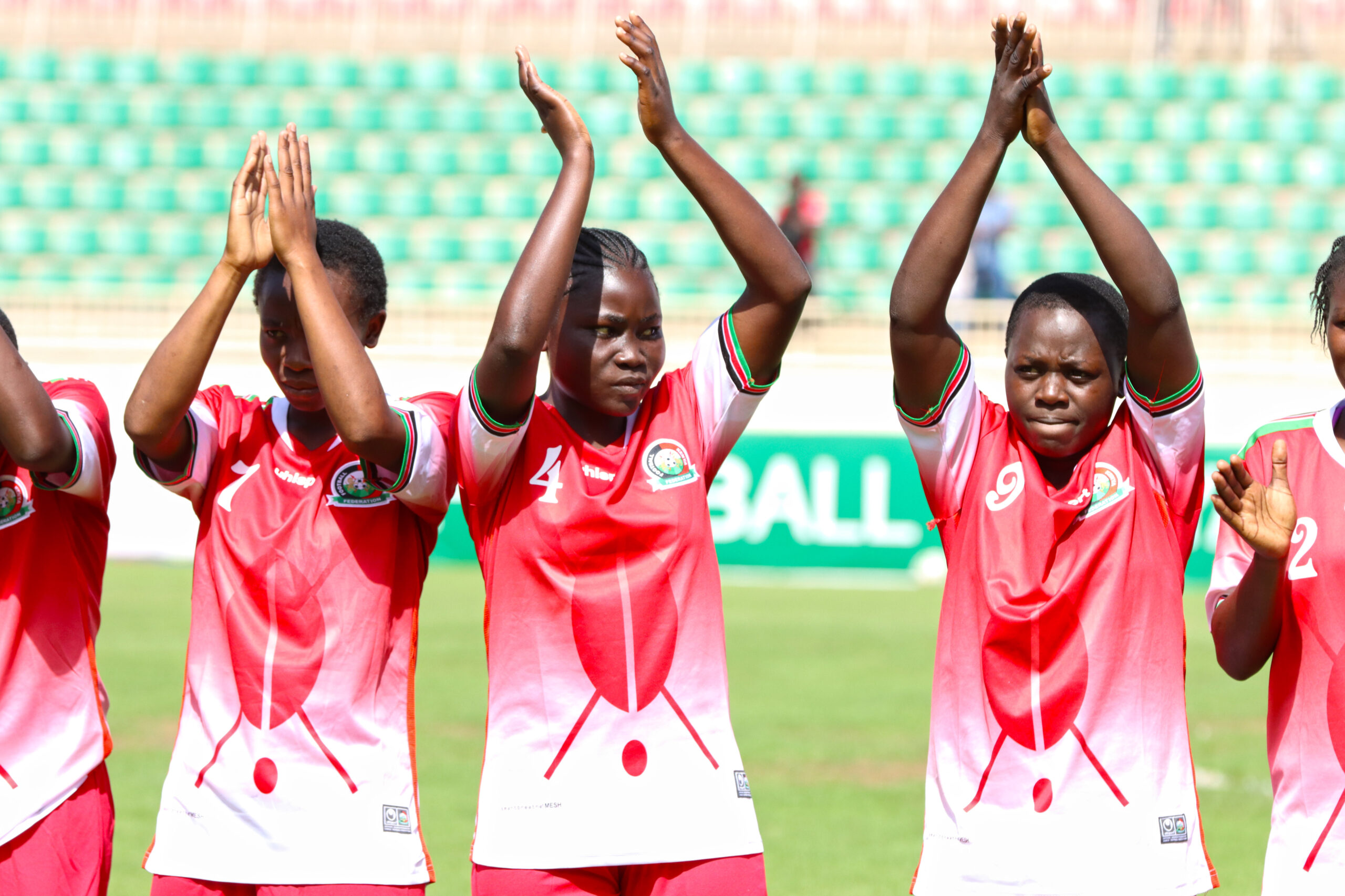 The Rising Starlets applaud the fans during the first leg match in Nairobi.