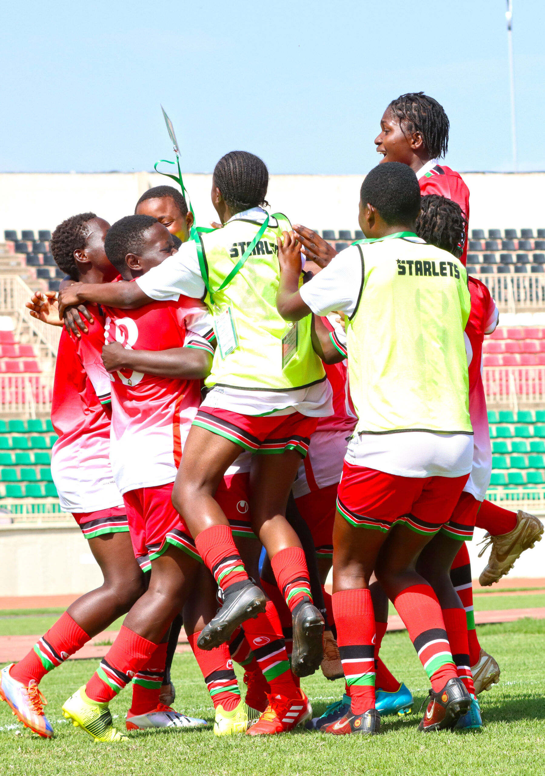 The Rising Starlets celebrate one of their six goals during the first leg match in Nairobi.
