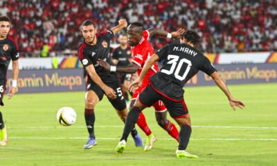 Simba's Clatous Chama attempts to find a way past Al Ahly defenders