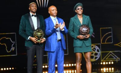 Nigerian stars Asisat Oshoala and Victor Osimhen with CAF president Patrice Motsepe after their awards.