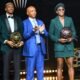 Nigerian stars Asisat Oshoala and Victor Osimhen with CAF president Patrice Motsepe after their awards.