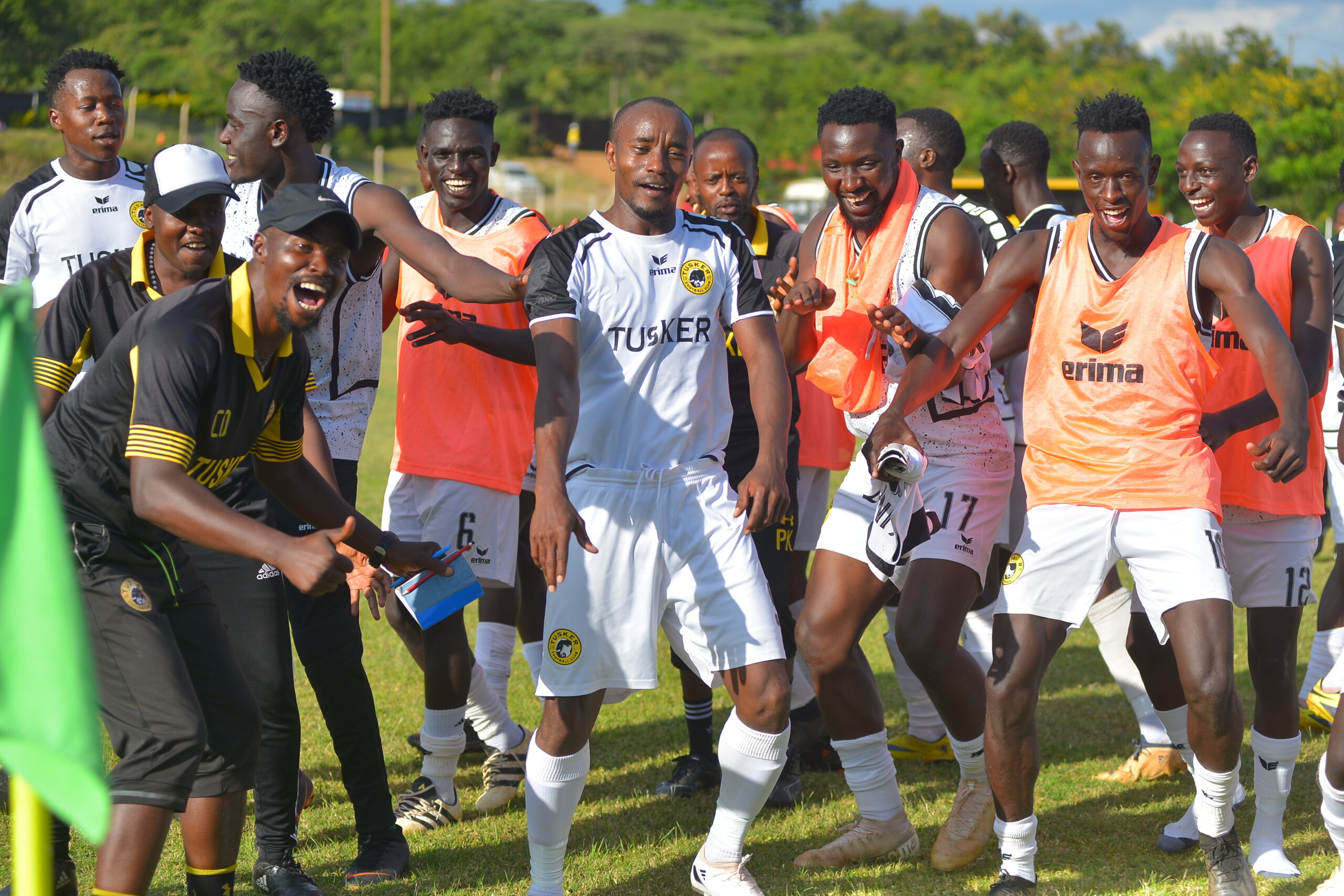 Eric Kapaito is joined by his teammates in celebrating one of his two goals