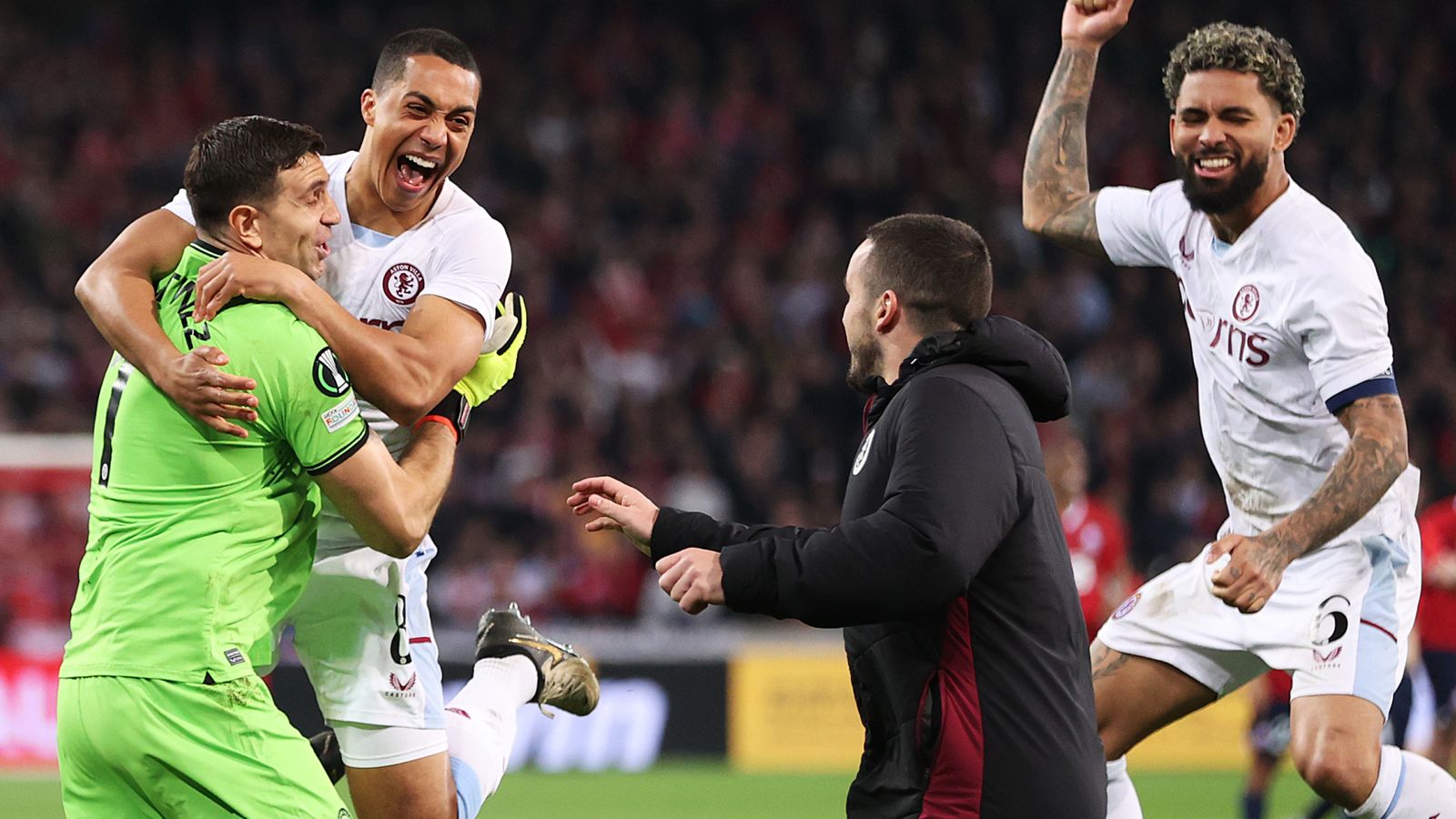 Aston Villa players celebrate with Emiliano Martinez.