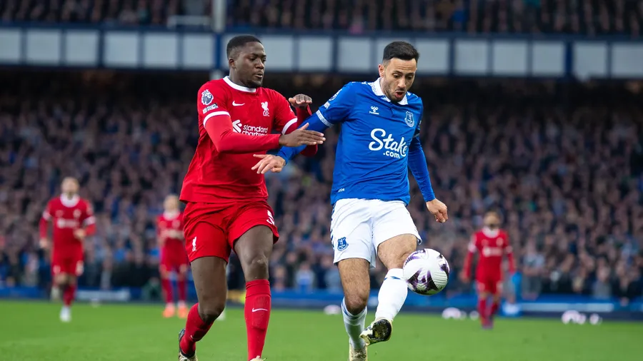 Konate battles the ball with McNeil