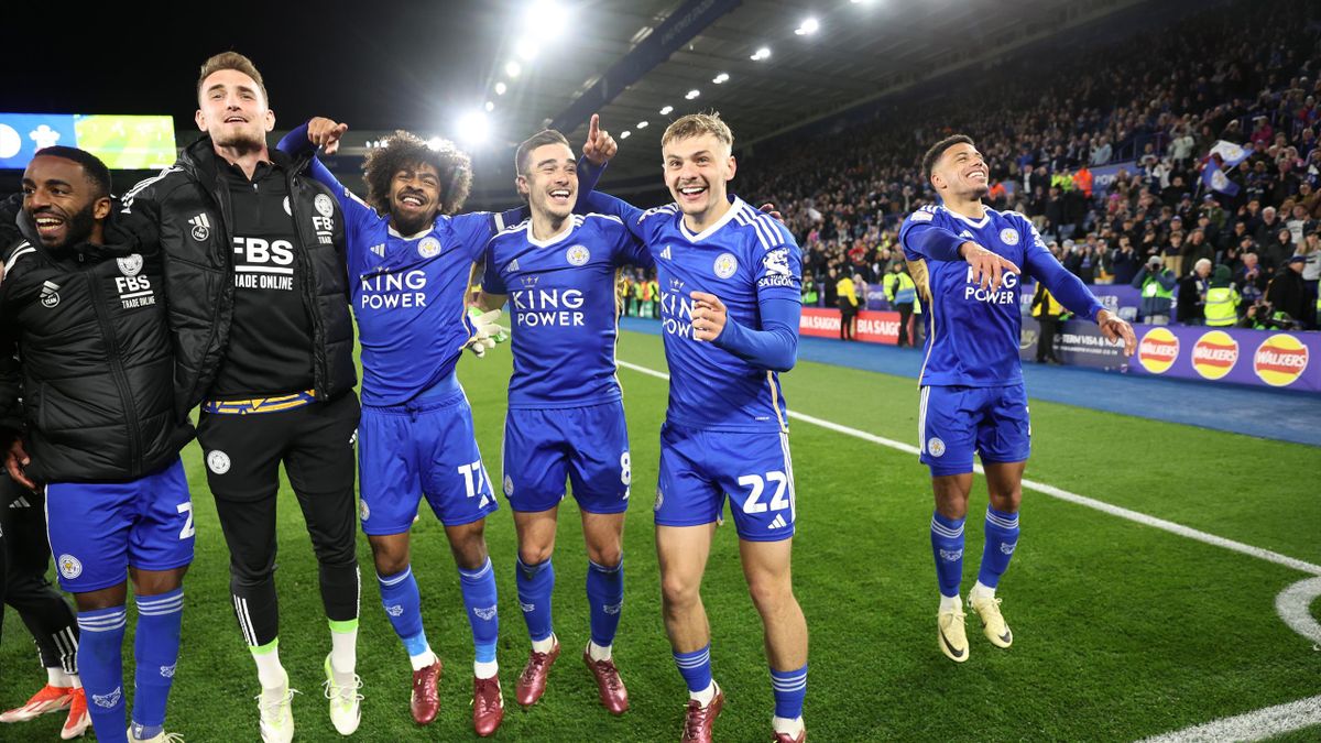 Leicester City players celebrate after winning a game.