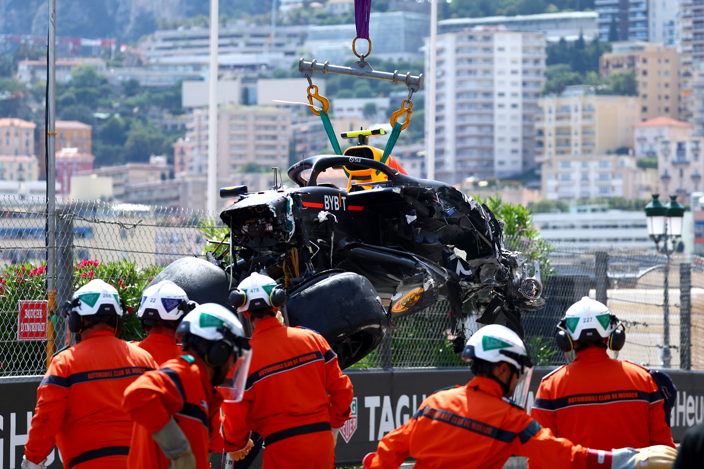 Stewards retrieve Perez's crashed car in the first lap of the Monaco Grand Prix